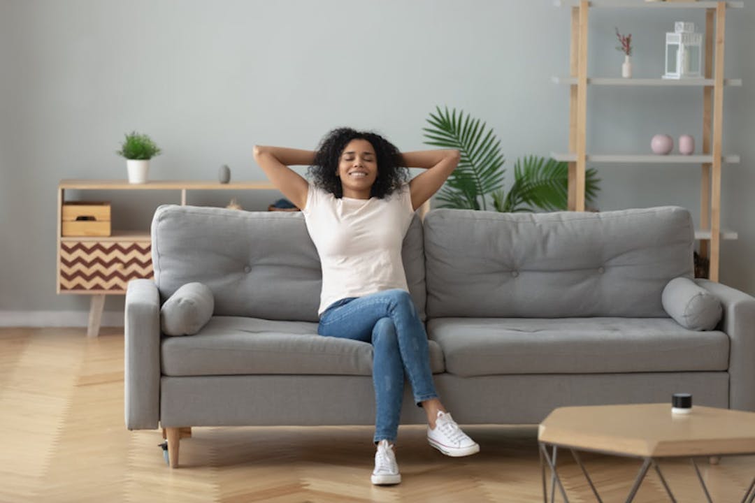 A woman relaxing on a couch